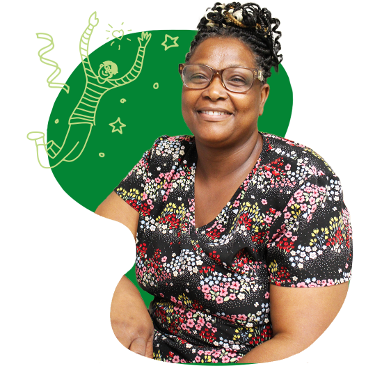 A woman wearing glasses in floral nurse scrubs