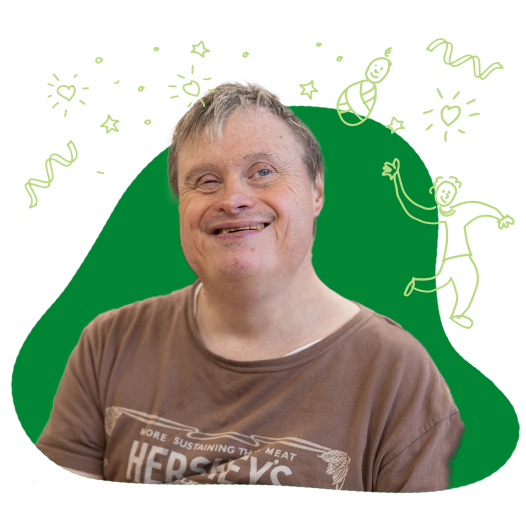 A man wearing a Hershey's shirt, smiling